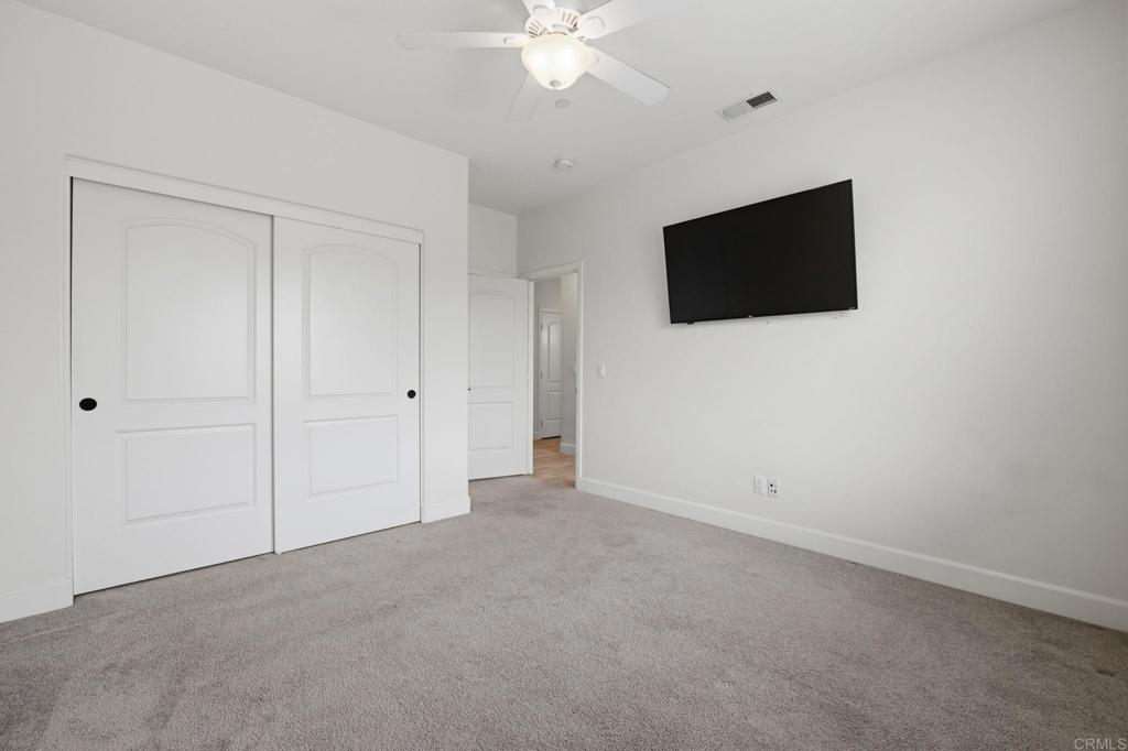 1910 Harbison Canyon Road El Cajon, CA 92019 - Photo 32 of 71 a view of an empty room with a ceiling fan