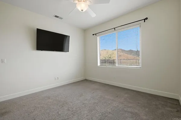 a bathroom with a shower and a glass door