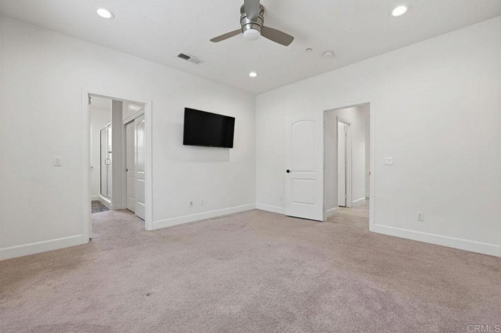 1910 Harbison Canyon Road El Cajon, CA 92019 - Photo 37 of 71 an empty room with closet and a flat screen tv