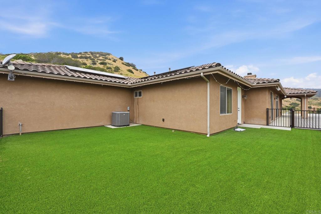 1910 Harbison Canyon Road El Cajon, CA 92019 - Photo 46 of 71 a view of a house with a backyard