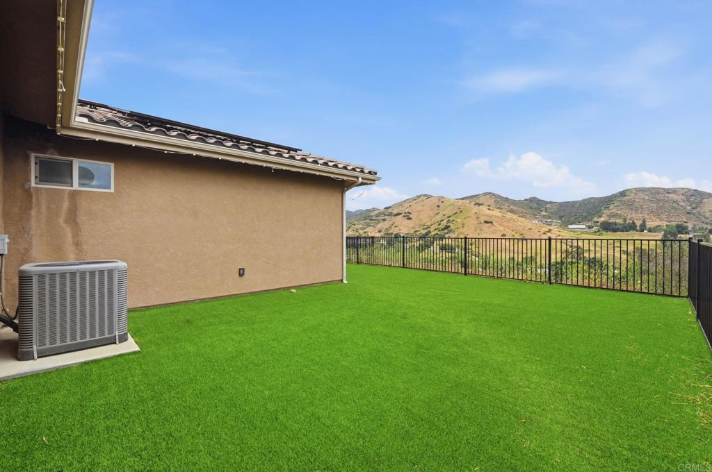 1910 Harbison Canyon Road El Cajon, CA 92019 - Photo 47 of 71 a view of a backyard with a garden and plants