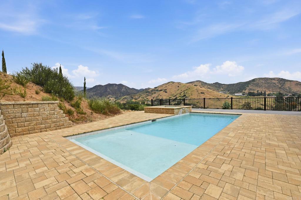 1910 Harbison Canyon Road El Cajon, CA 92019 - Photo 56 of 71 a view of swimming pool with a yard