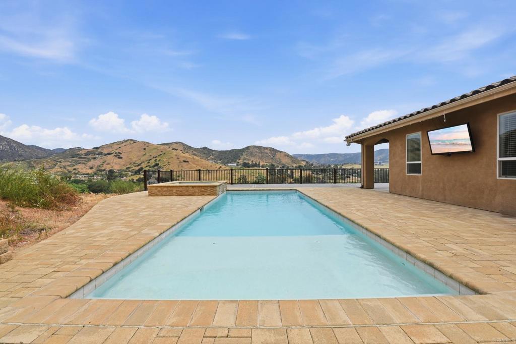 1910 Harbison Canyon Road El Cajon, CA 92019 - Photo 57 of 71 a view of swimming pool with a yard