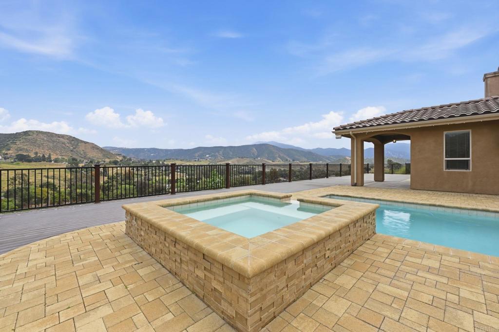1910 Harbison Canyon Road El Cajon, CA 92019 - Photo 58 of 71 a view of a house with swimming pool and a yard