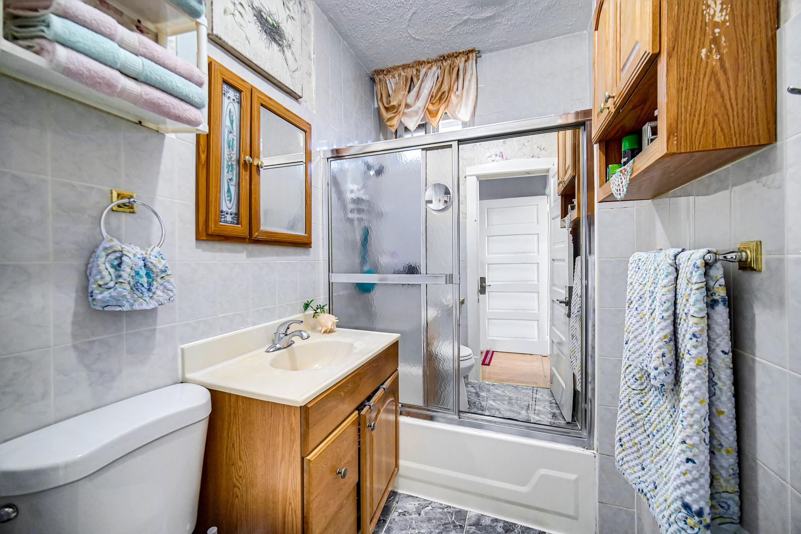 Undisclosed Address Chicago, IL 60641 - Photo 12 of 18 a bathroom with a sink mirror vanity and toilet