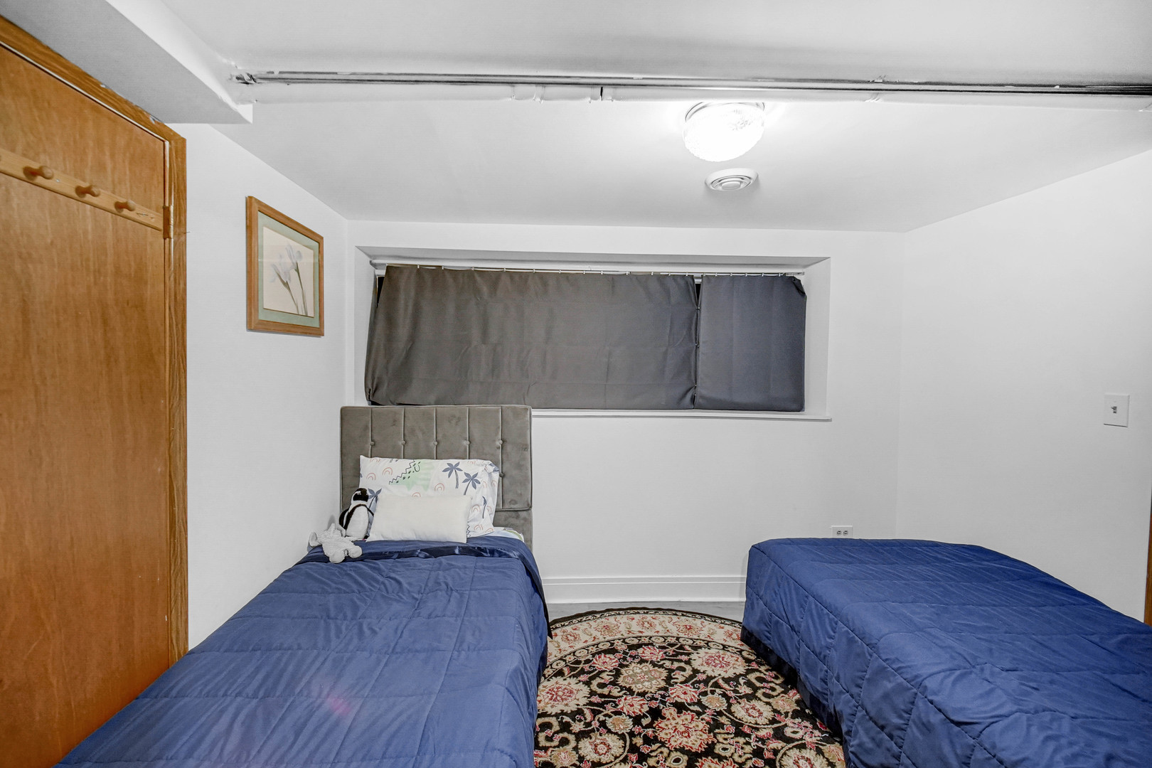 Undisclosed Address Chicago, IL 60641 - Photo 16 of 18 a bedroom with a bed and wooden floor