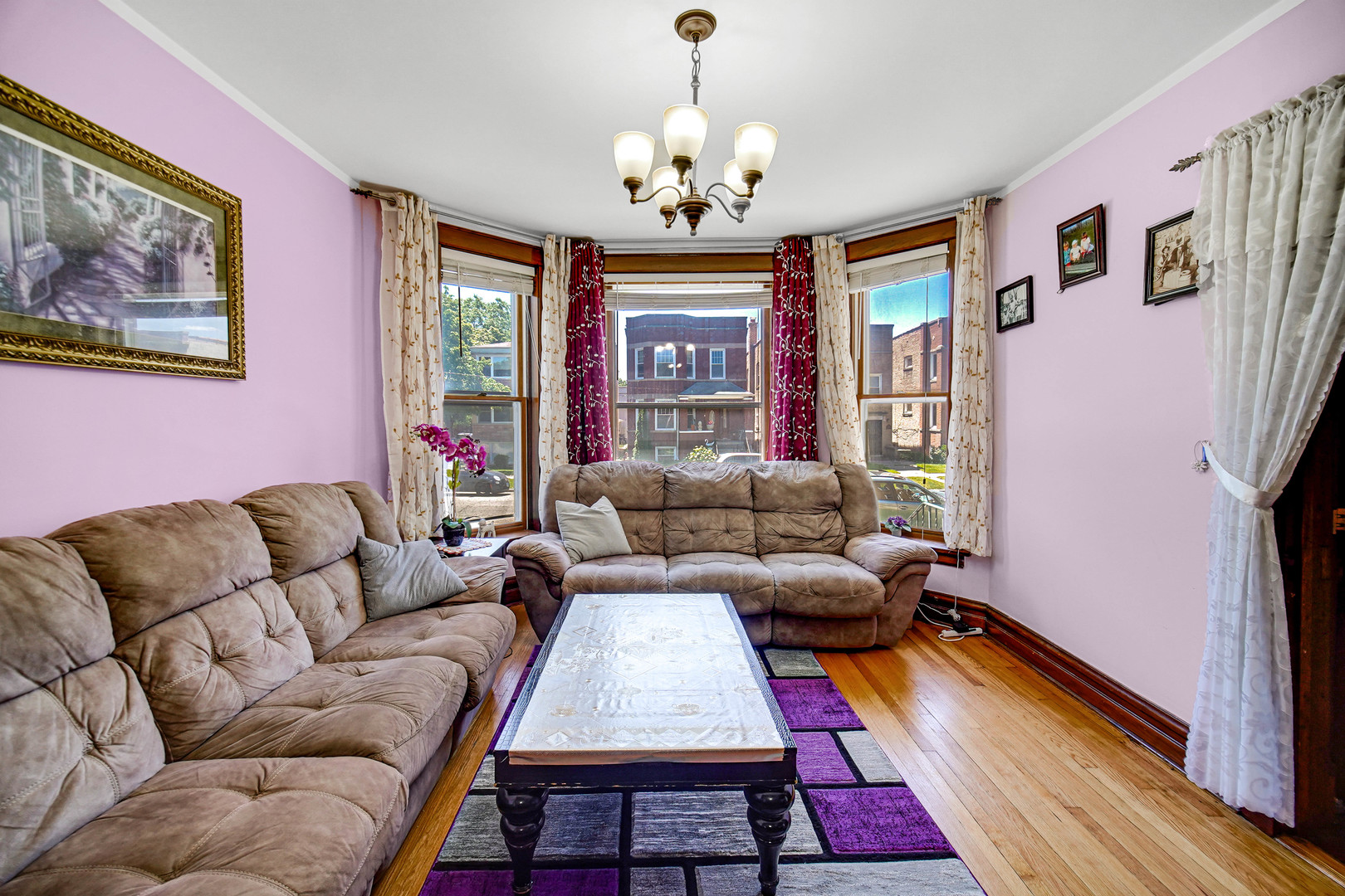 Undisclosed Address Chicago, IL 60641 - Photo 3 of 18 a living room with furniture and a chandelier
