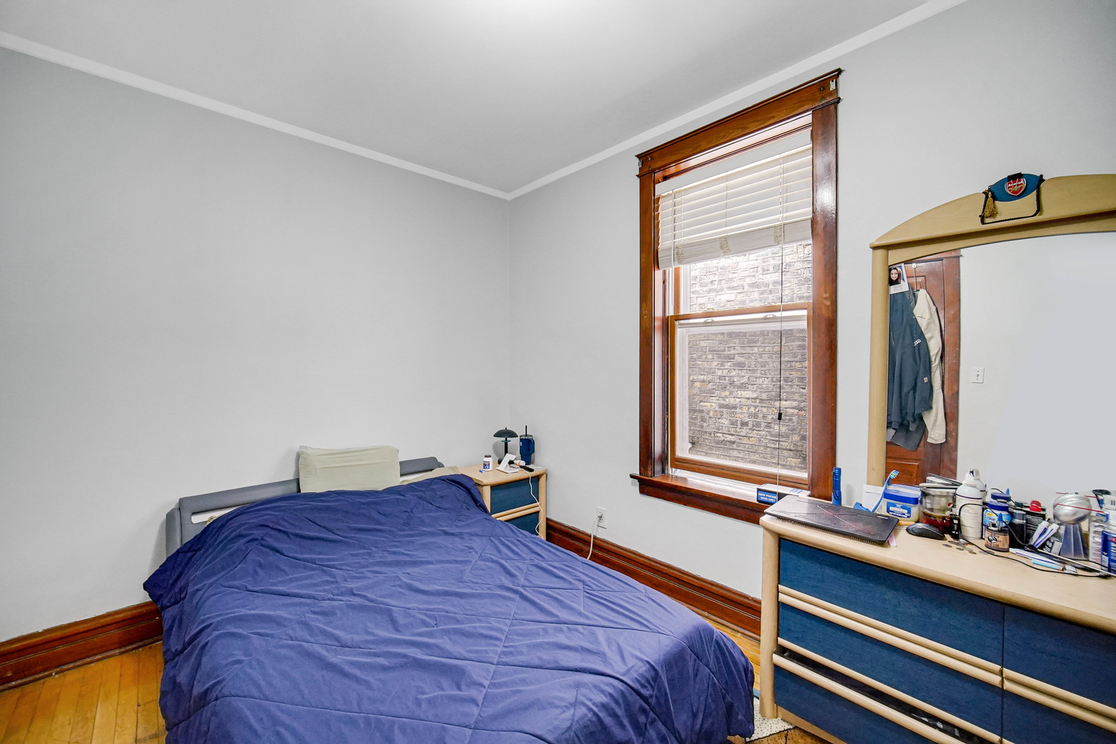 Undisclosed Address Chicago, IL 60641 - Photo 6 of 18 a bed sitting in a bedroom next to a window