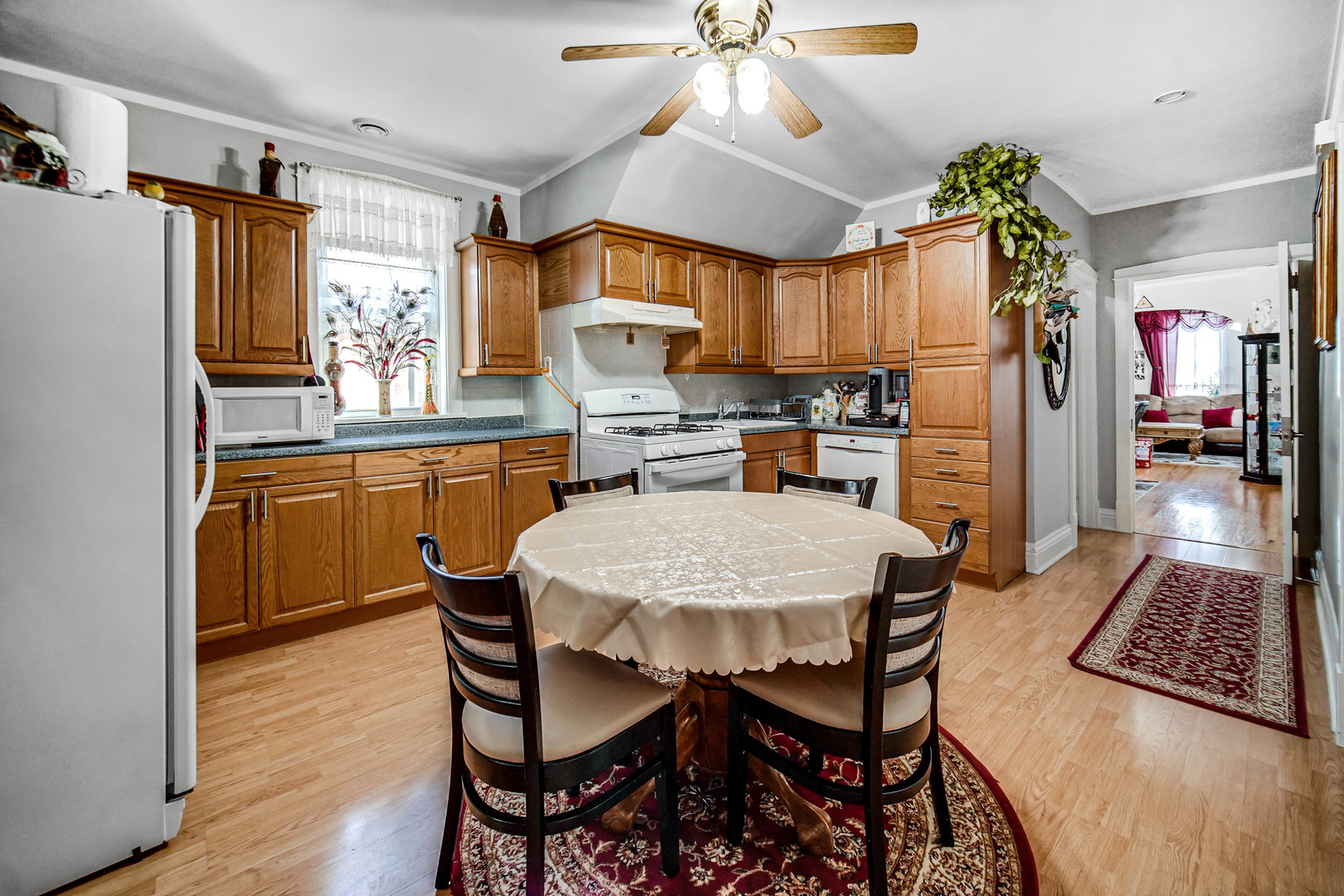 Undisclosed Address Chicago, IL 60641 - Photo 9 of 18 a kitchen with stainless steel appliances a dining table chairs refrigerator and sink