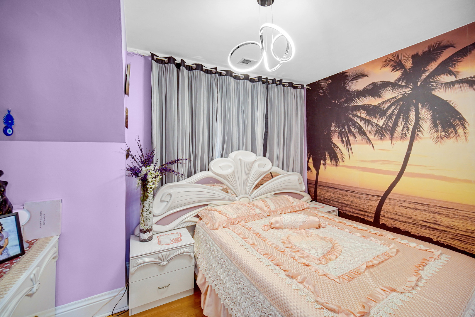 Undisclosed Address Chicago, IL 60641 - Photo 10 of 18 a bed sitting in a bedroom next to a window and a palm tree