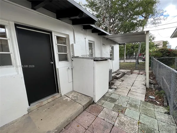 a view of a back yard of the house