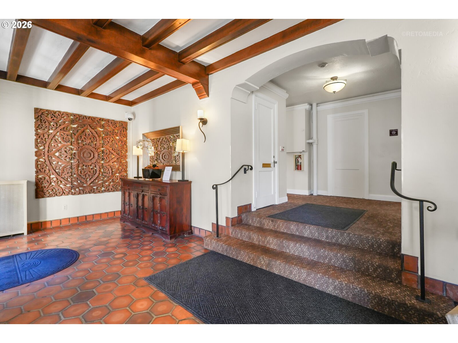 709 Southwest 16th Avenue, Unit 308 Portland, OR 97205 - Photo 5 of 22 a spacious bedroom with a bed and a dresser