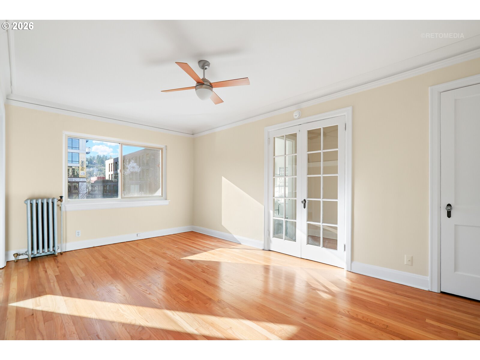 709 Southwest 16th Avenue, Unit 308 Portland, OR 97205 - Photo 8 of 22 a view of empty room with wooden floor and fan