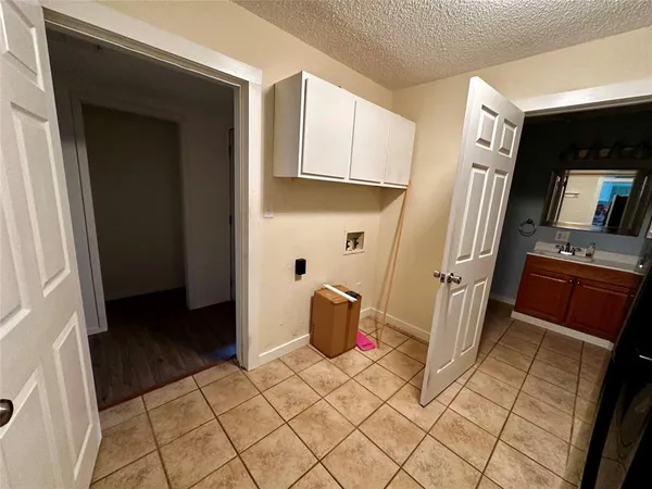 a view of a kitchen from the hallway