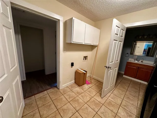 a view of a kitchen from the hallway