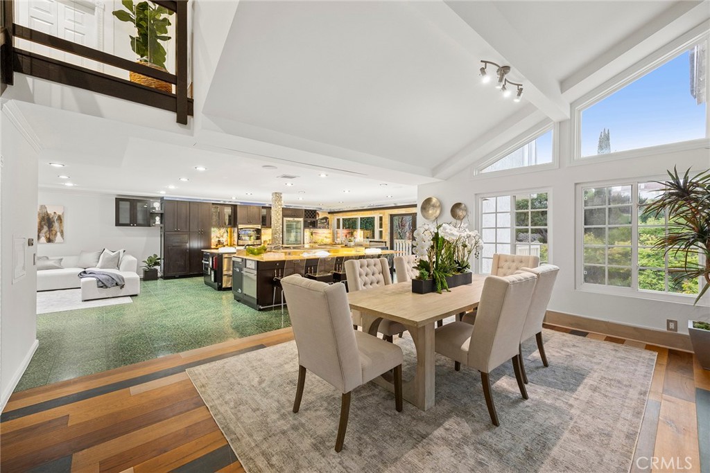 6641 East Canyon Hills Road Anaheim Hills, CA 92807 - Photo 12 of 44 a view of a dining room with furniture window and wooden floor