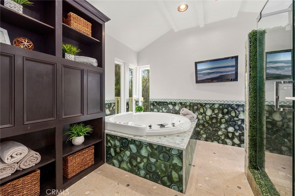 6641 East Canyon Hills Road Anaheim Hills, CA 92807 - Photo 27 of 44 a bathroom with a sink a mirror and a shower