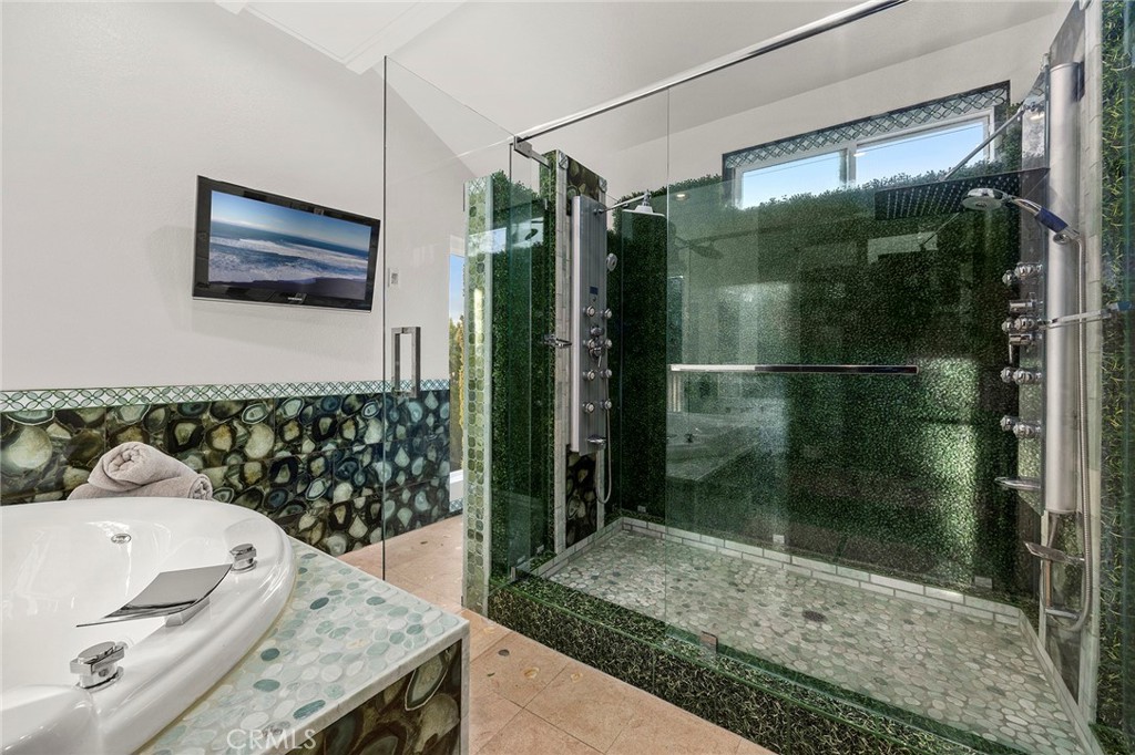 6641 East Canyon Hills Road Anaheim Hills, CA 92807 - Photo 28 of 44 a bathroom with a granite countertop sink a mirror and shower