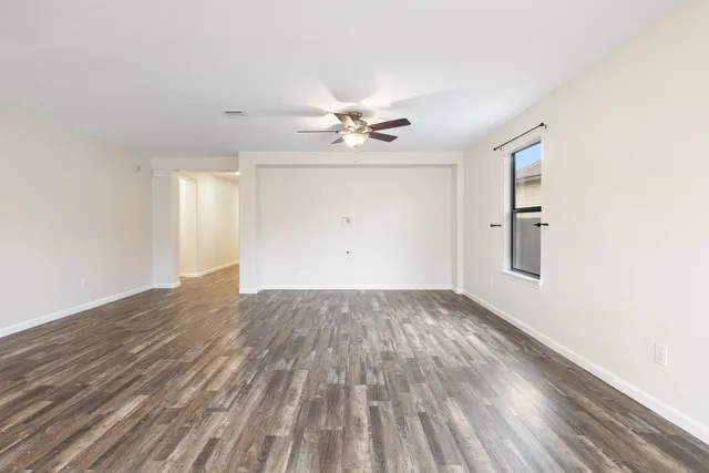 a view of a kitchen with a stove cabinets and wooden floor