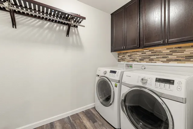 a large kitchen with stainless steel appliances granite countertop a stove a sink and a refrigerator