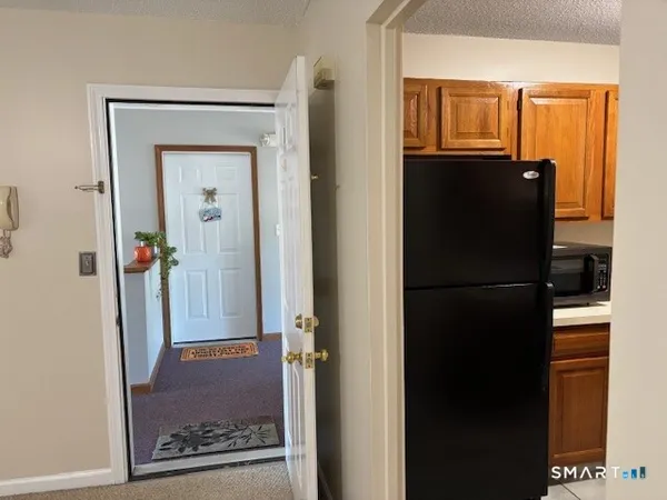 a view of a bedroom from a hallway