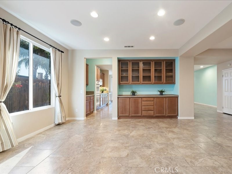 19069 Eldorado Road Perris, CA 92570 - Photo 13 of 49 a view of an empty room with kitchen and windows