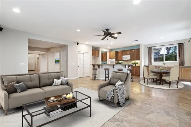 a view of a livingroom with furniture and a kitchen