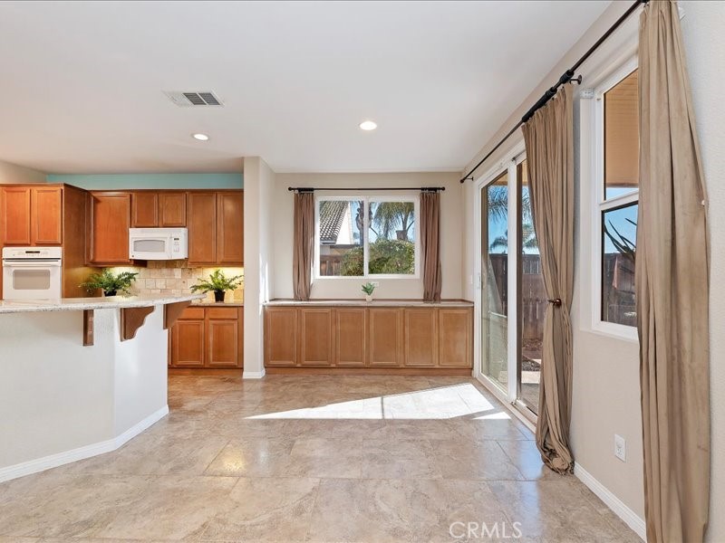 19069 Eldorado Road Perris, CA 92570 - Photo 17 of 49 a view of kitchen with granite countertop window and stainless steel appliances