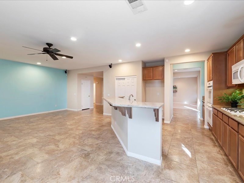 19069 Eldorado Road Perris, CA 92570 - Photo 22 of 49 a view of a kitchen with a sink and cabinets