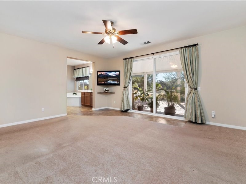 19069 Eldorado Road Perris, CA 92570 - Photo 28 of 49 a view of a livingroom with a ceiling fan and window