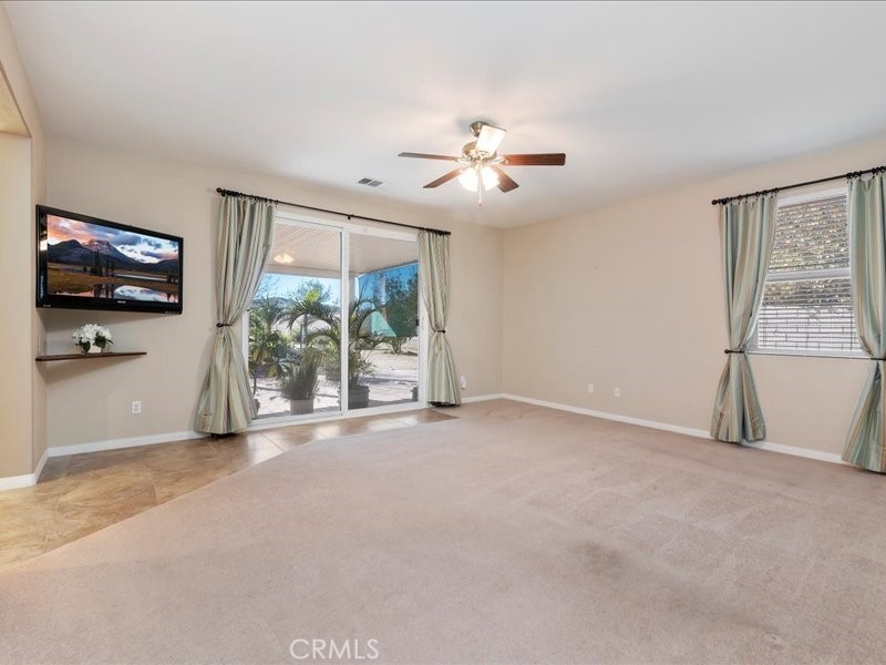 19069 Eldorado Road Perris, CA 92570 - Photo 30 of 49 a view of an empty room with a flat screen tv