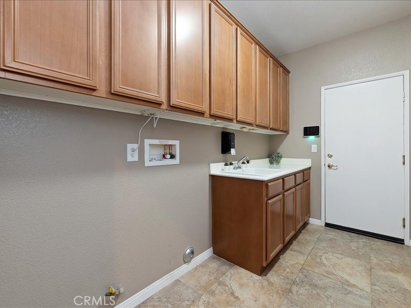 19069 Eldorado Road Perris, CA 92570 - Photo 38 of 49 a utility room with cabinets