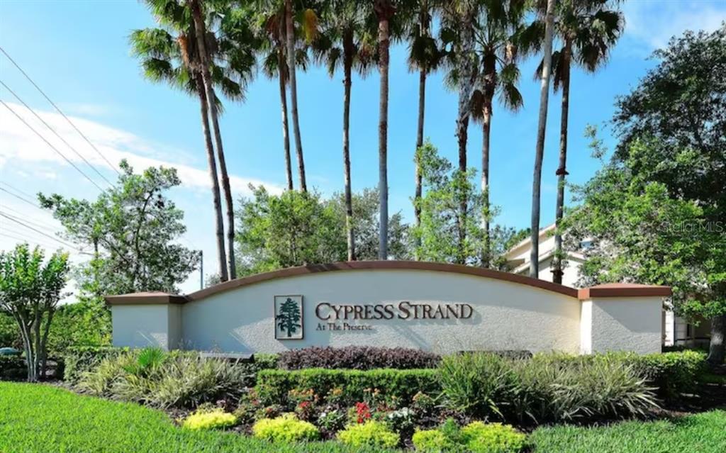 7189 Strand Circle, Unit 1 Bradenton, FL 34203 - Photo 18 of 19 a sign on the side of the road