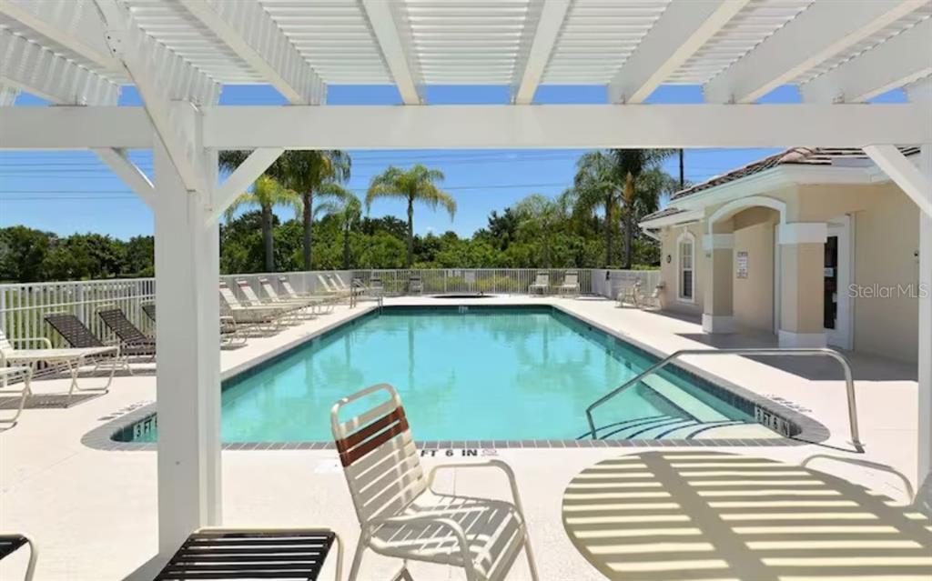 7189 Strand Circle, Unit 1 Bradenton, FL 34203 - Photo 19 of 19 a view of swimming pool with seating area
