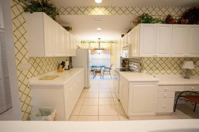 a bathroom with a sink a mirror and a bathtub