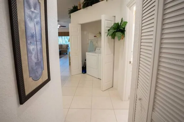 a view of a hallway and closet