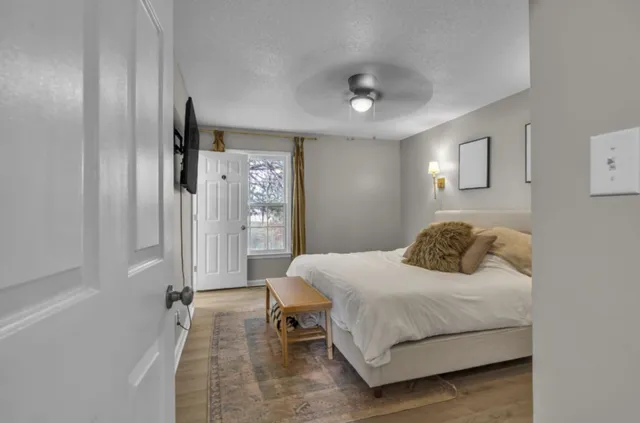 a bedroom with a bed and a table