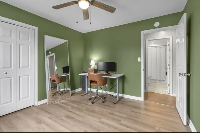 a view of a livingroom with a chair and a fireplace