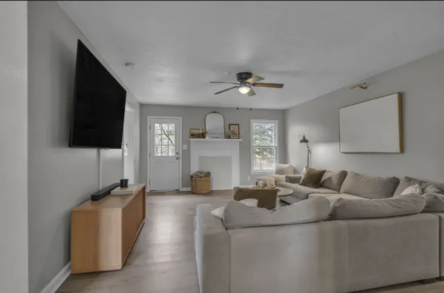 a living room with furniture and a flat screen tv