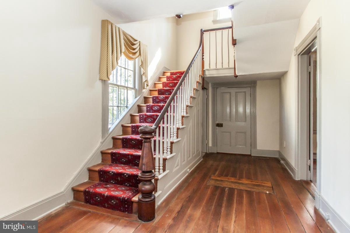 315 Farmhouse Road Accokeek, MD 20607 - Photo 2 of 30 a view of entryway with wooden floor and stairs