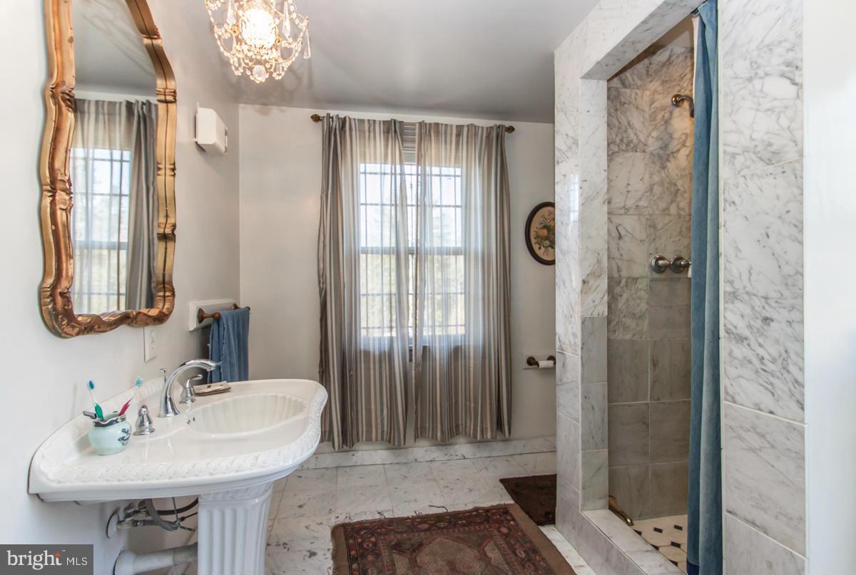 315 Farmhouse Road Accokeek, MD 20607 - Photo 14 of 30 a bathroom with a sink and a mirror