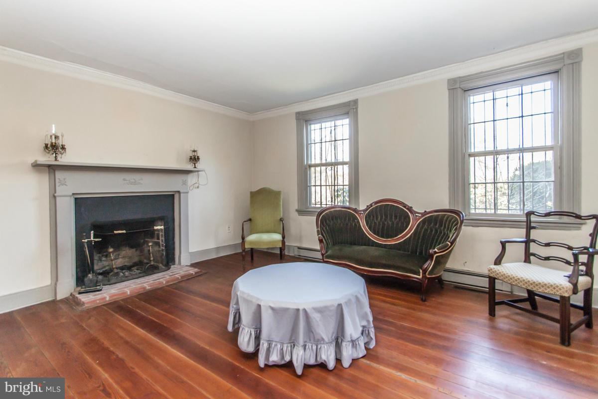 315 Farmhouse Road Accokeek, MD 20607 - Photo 3 of 30 a living room with furniture a fireplace and window