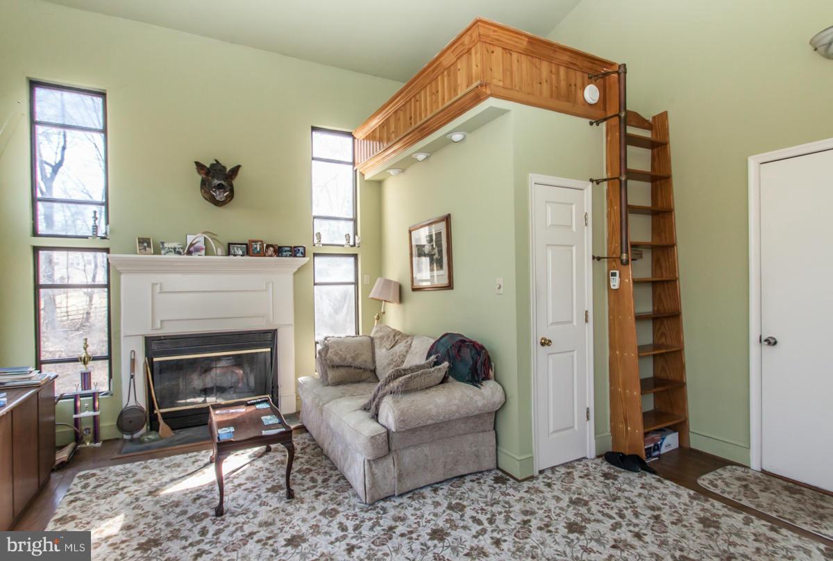 315 Farmhouse Road Accokeek, MD 20607 - Photo 29 of 30 a living room with furniture and a fireplace