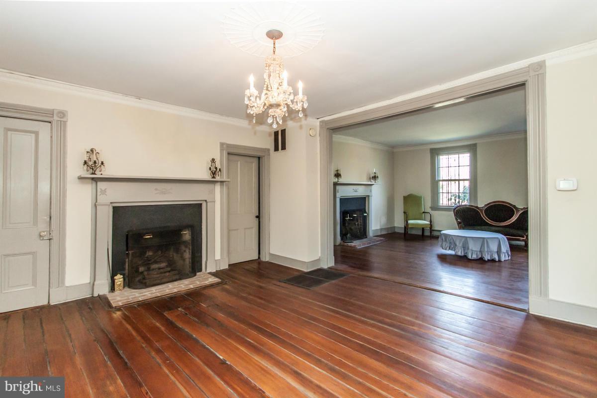 315 Farmhouse Road Accokeek, MD 20607 - Photo 4 of 30 a living room with furniture and a fireplace