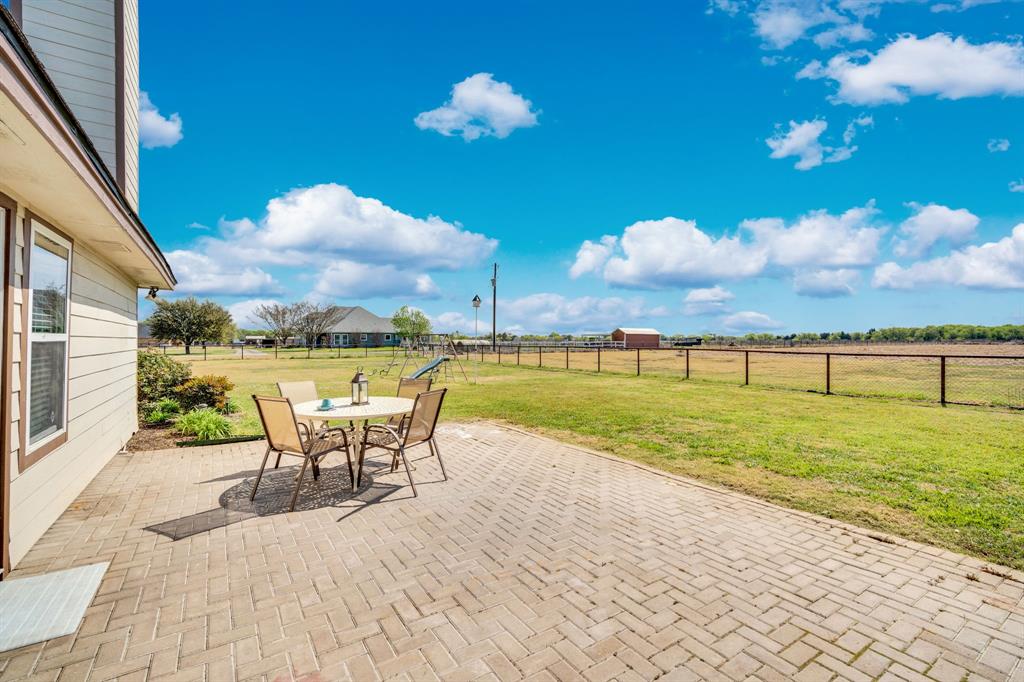 130 Eubanks Road Maypearl, TX 76064 - Photo 24 of 39 a view of a swimming pool with a patio