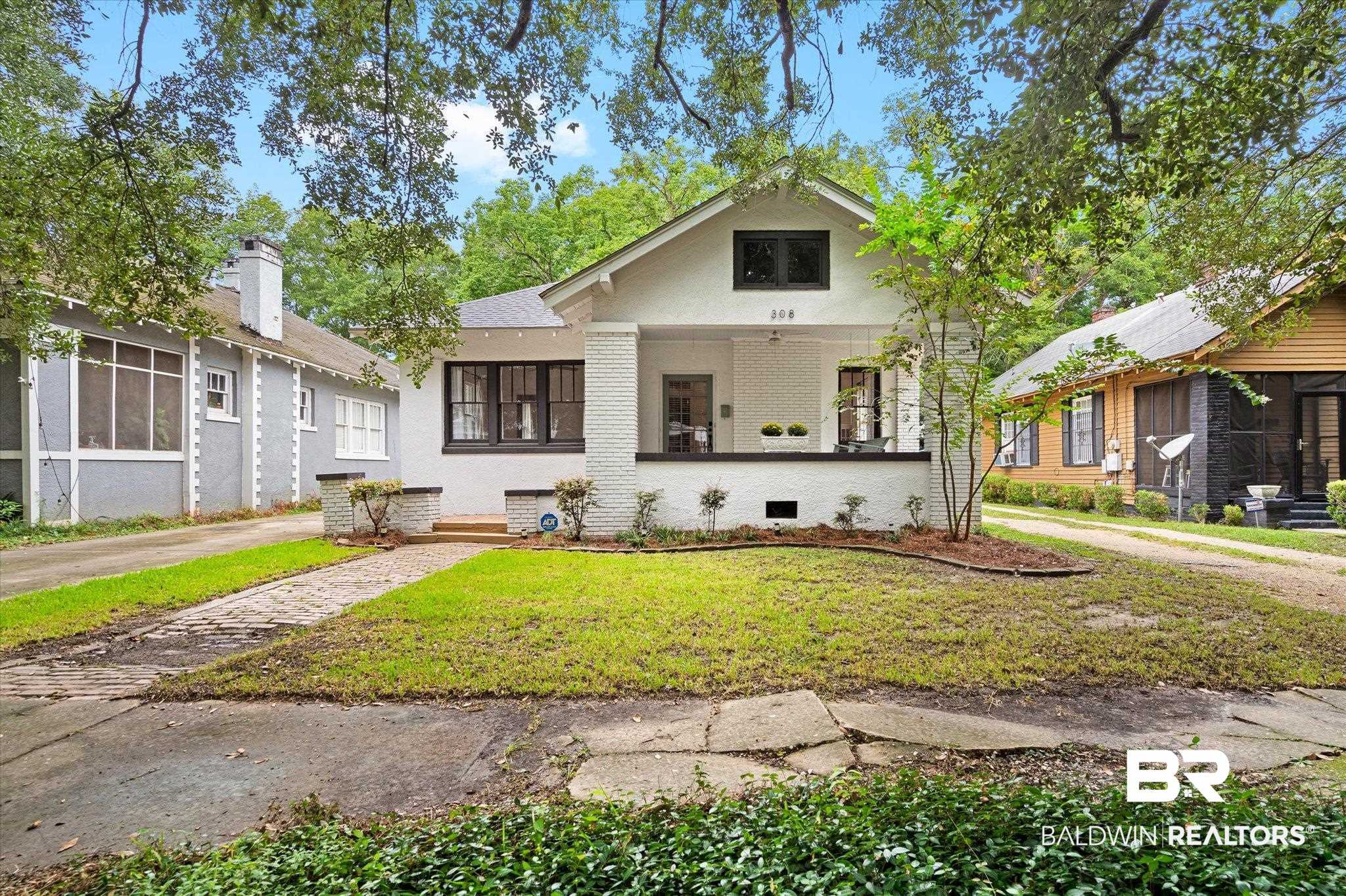 Bungalow-style home featuring a front yard