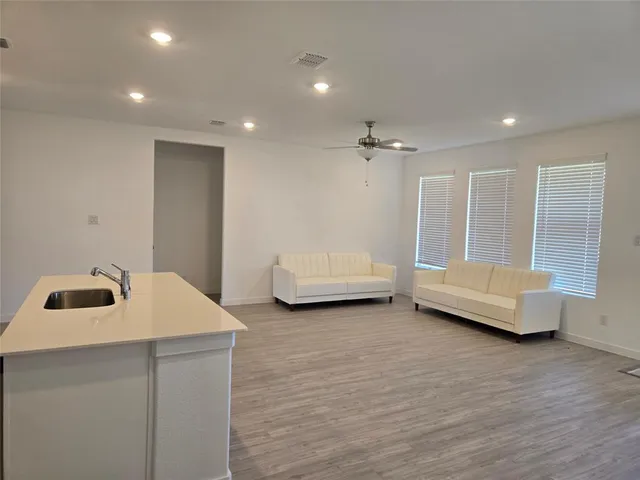 a view of kitchen with wooden floor
