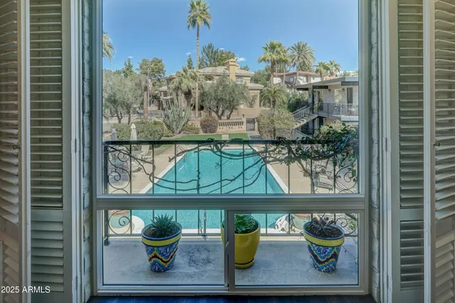 a glass window with glass vase on top of it