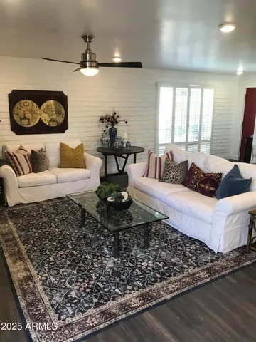 a living room with furniture and a rug
