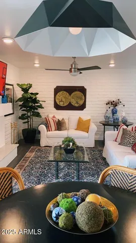 a living room with furniture and a rug